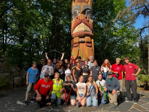 Volunteers with Totem Pole at Elk Point